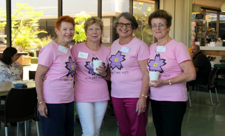 Four women wearing pink shirts standing in Fremantle Hospital cafe